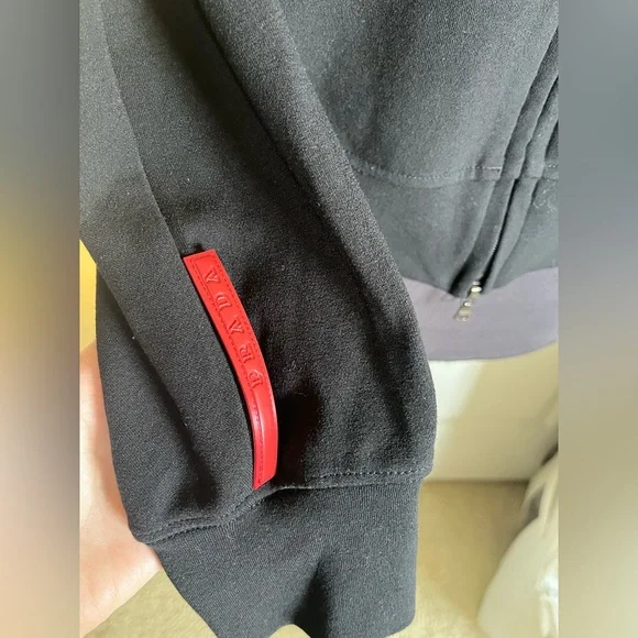 Prada Milano Black Zip-Up Hoodie – Made in Italy – Size L – Red Logo Sleeve